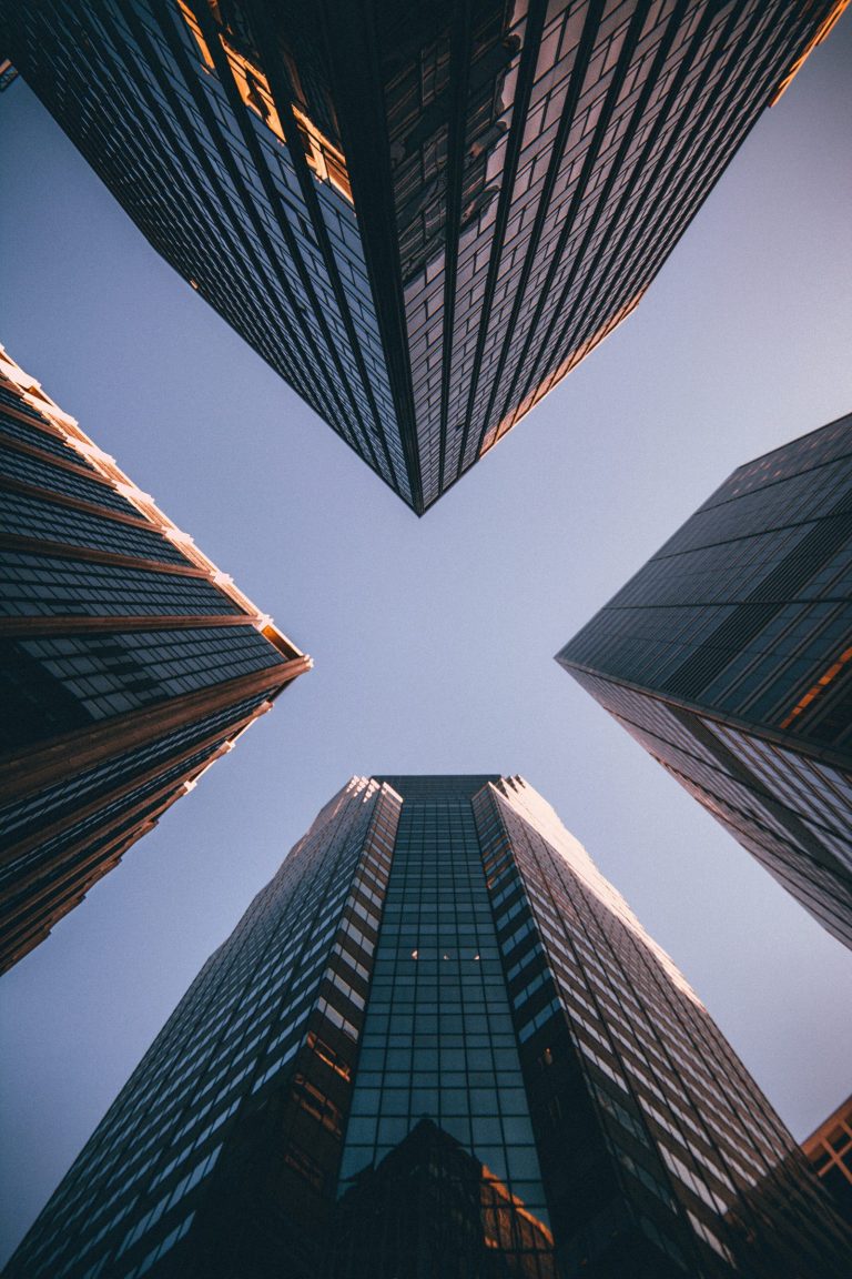 Four skyscrapers converging towards the sky